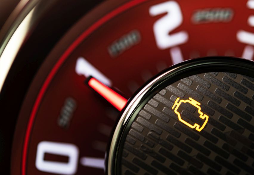 Why Is My Engine Light On But the Car Feels Fine? Close-up of a glowing check engine warning light on a car dashboard, highlighting the need for professional engine diagnostics by Auto King in London.