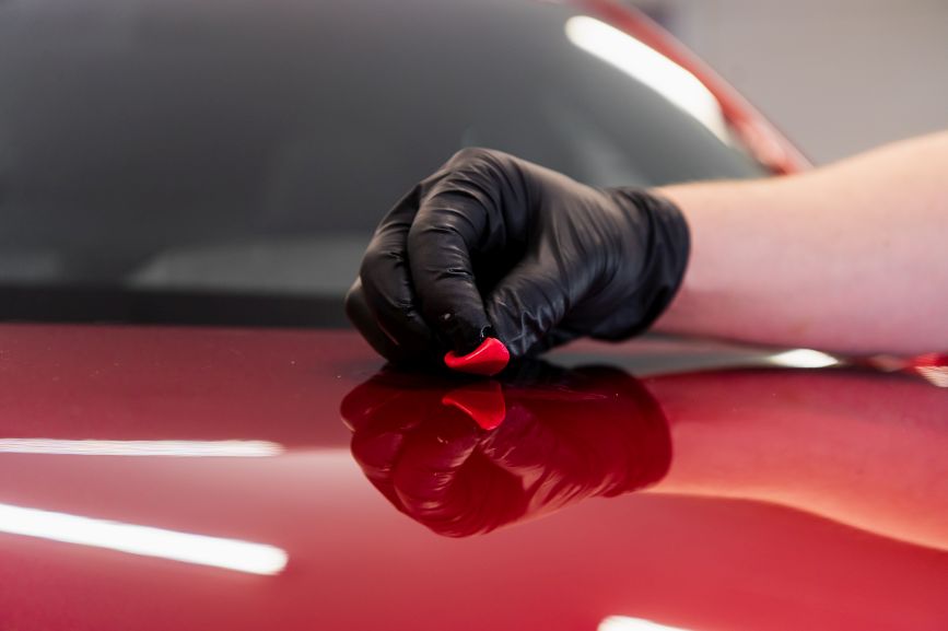 car paint chip repair restores a flawless red finish